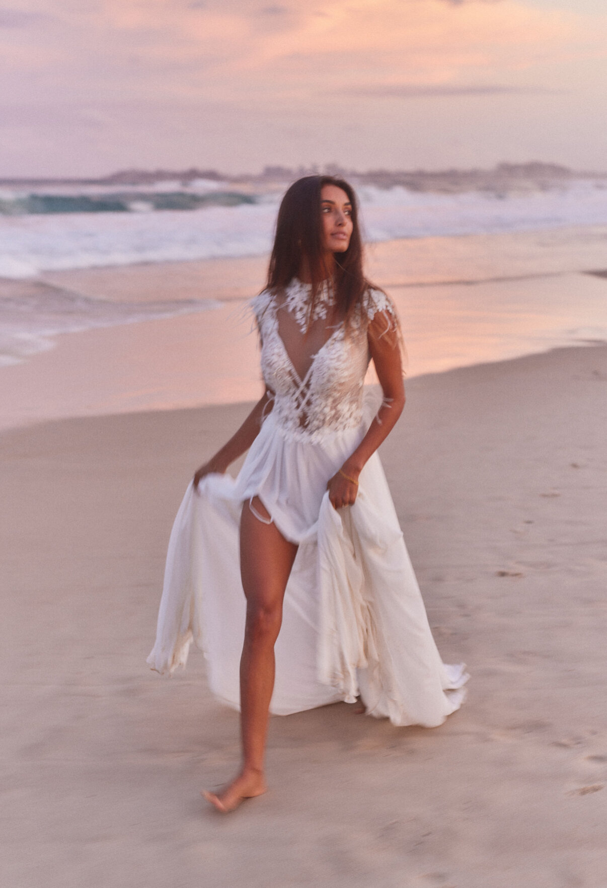 An Ela Elu gown photographed on Currumbin beach at dusk