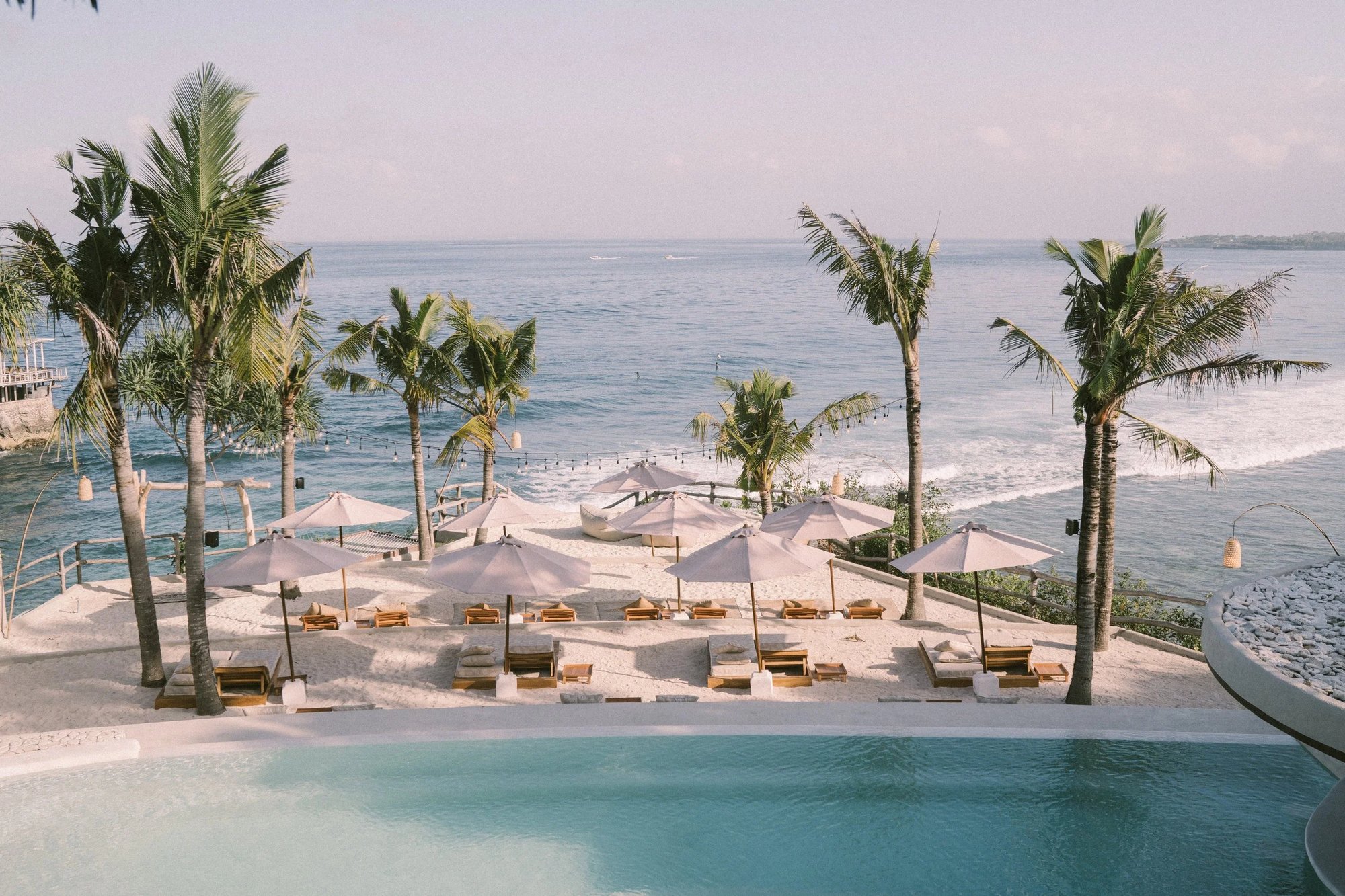 Beach club terrace on the cliffs of Nusa Ceningan, looking out toward Mahana Point
